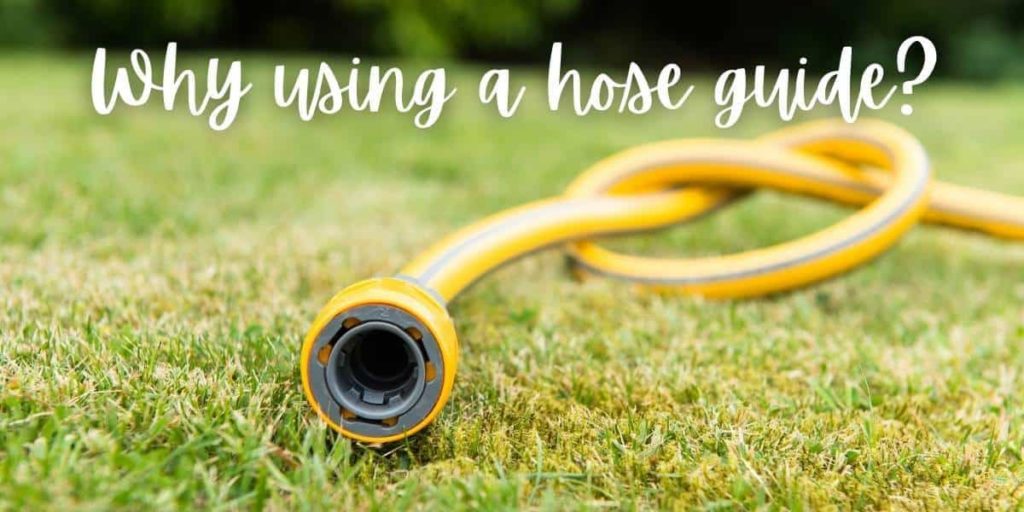 tangled garden hose pipe laying on the lawn avoided by using water hose roller guides